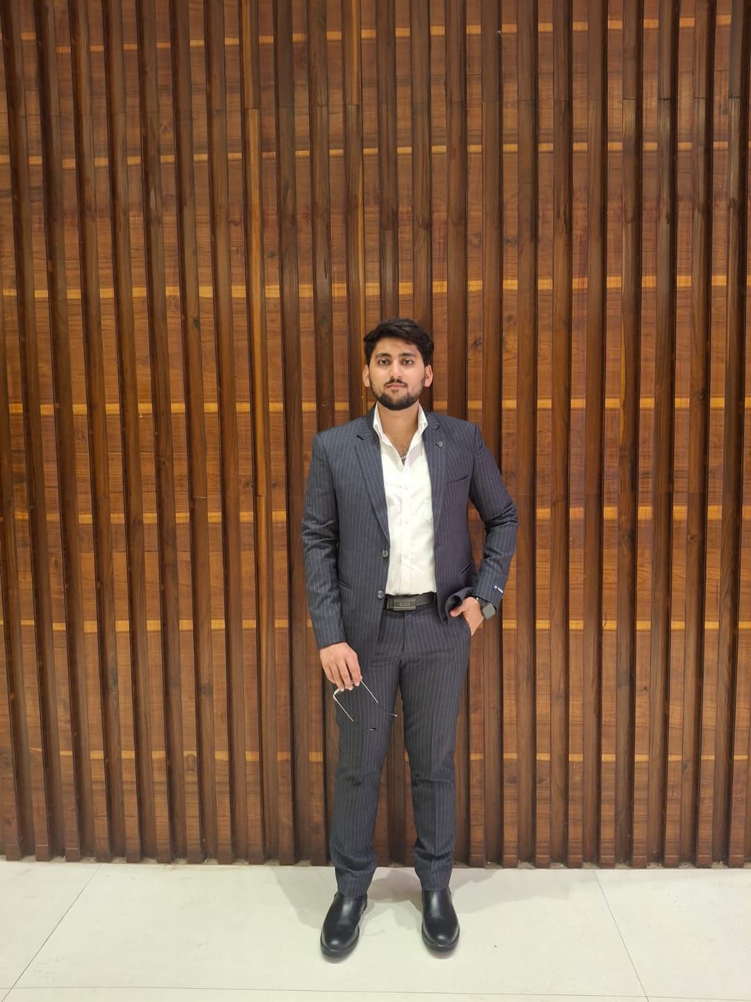 Formal portrait of Akshat Tiwari in a suit